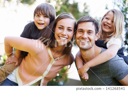 Portrait, smile and family outdoor in nature for love, bonding and piggyback for siblings together. Face, happy parents and carrying kids at garden for connection with mother, father and children 141268541