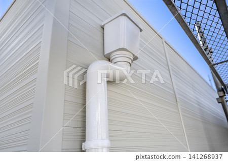 Downpipes for rainwater drainage on the flat roof and new siding Downpipes for rainwater drainage on the flat roof and new siding 141268937