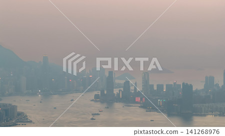 July 11 2026. Hong Kong Victoria Harbour Skyline Through Evening Haze July 11 2026. Hong Kong Victoria Harbour Skyline Through Evening Haze 141268976
