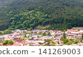 Houses nestled in the mountains and rural townscapes, surrounded by lush, deep forests. 141269003