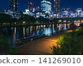 The night view along the Okawa River, with its beautiful reflection of building lights on the water's surface. 141269010