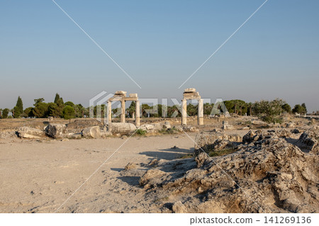 Discover the fascinating ancient site of Pamukkale featuring well-preserved ruins and mesmerizing natural formations during a serene afternoon. Discover the fascinating ancient site of Pamukkale featuring well-preserved ruins and mesmerizing natural formations during a serene afternoon. 141269136