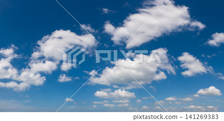 Wide angle panorama of beautiful sky with cumulus clouds over a clear horizon. Wide angle panorama of beautiful sky with cumulus clouds over a clear horizon. 141269383