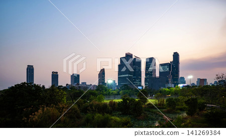 Energetic panorama view of Bangkok CBD, city lifestyle and traffic movement during the blue hour. Energetic panorama view of Bangkok CBD, city lifestyle and traffic movement during the blue hour. 141269384