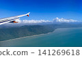 From the airplane window, I gazed down upon the clear, marine-blue sea and the rugged coastline of the mountains. 141269618