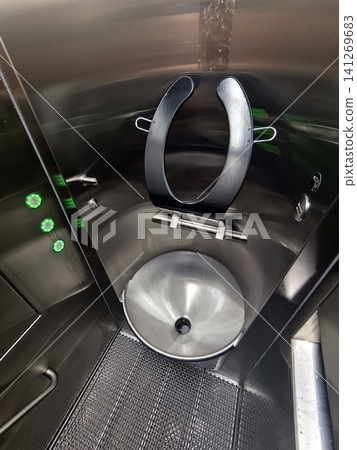 Modern road toilet cabin on the autobahn. Automatic robotic bathroom Modern road toilet cabin on the autobahn. Automatic robotic bathroom 141269683