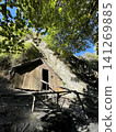 A nostalgic old stone hut from the gold rush era, surrounded by autumn trees. 141269885