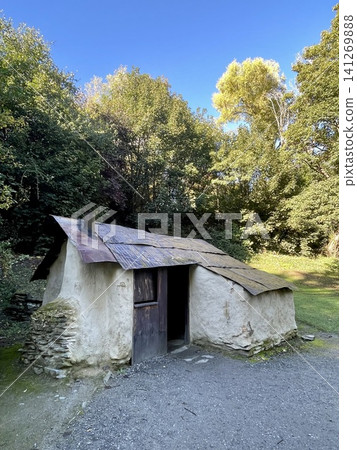 The historic white stucco huts of Arrowtown stand out against the backdrop of beautiful yellow foliage and blue sky. The historic white stucco huts of Arrowtown stand out against the backdrop of beautiful yellow foliage and blue sky. 141269888