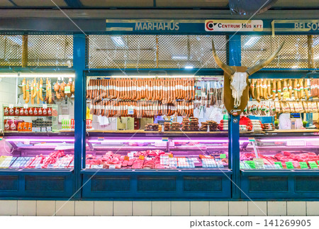 A butcher shop in Budapest Central Market, Hungary, featuring famous salami and a cow's skull as decoration. A butcher shop in Budapest Central Market, Hungary, featuring famous salami and a cow's skull as decoration. 141269905