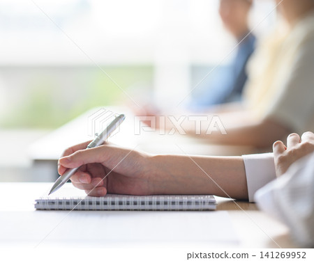 Hand writing in notebook Hand writing in notebook 141269952