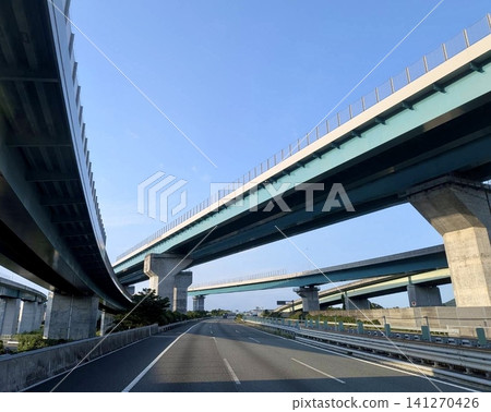 The elevated bridges and highways of the overpasses spread out under the blue sky. The elevated bridges and highways of the overpasses spread out under the blue sky. 141270426