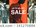 Retail store window display with sale sign 141270884