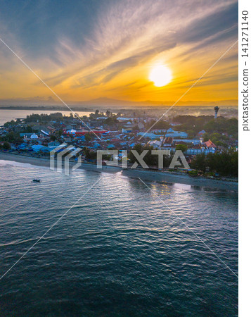 Sunset beach in Indonesia with golden waves and pristine white sand capturing tropical beauty and serene coastal atmosphere Sunset beach in Indonesia with golden waves and pristine white sand capturing tropical beauty and serene coastal atmosphere 141271140