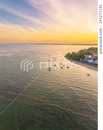 Sunset beach in Indonesia with golden waves and pristine white sand capturing tropical beauty and serene coastal atmosphere Sunset beach in Indonesia with golden waves and pristine white sand capturing tropical beauty and serene coastal atmosphere 141271141