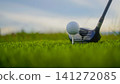 Golf clubs and balls on a green lawn in a beautiful golf course with morning sunshine. 141272085