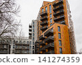 Multi story residential apartment complex with balconies 141274359