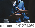 Doctor use stethoscope, checking up heart beat, auscultation in doctor office at hospital. Patient worker has to get medical checkup every year for her health or 141274869