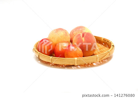 Peaches and plums on a sieve Peaches and plums in a basket Peaches and plums on a sieve Peaches and plums in a basket 141276080