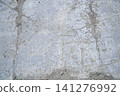 Grey concrete surface with many scratches 141276992