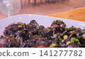 Traditional Southern Thai Stir Fried Squid in Rich Black Ink Sauce 141277782