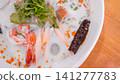 Creamy Thai Coconut Tom Yum Seafood Soup 141277783
