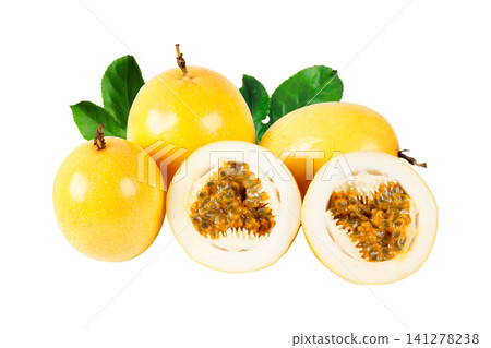 Group of fresh yellow passion fruits with sliced halves revealing aromatic pulp and seeds, decorated with green leaves and isolated on a white background Group of fresh yellow passion fruits with sliced halves revealing aromatic pulp and seeds, decorated with green leaves and isolated on a white background 141278238