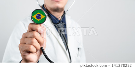 Brazil healthcare system, Brazilian national healthcare concept. Hand of doctor holding stethoscope Brazil healthcare system, Brazilian national healthcare concept. Hand of doctor holding stethoscope 141278252