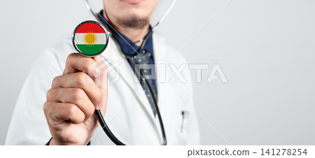 Kurdistan healthcare system, Kurdish national healthcare concept. Hand of doctor holding stethoscope Kurdistan healthcare system, Kurdish national healthcare concept. Hand of doctor holding stethoscope 141278254