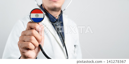 Paraguay healthcare system, Paraguayan national healthcare concept. Hand of doctor holding stethoscope Paraguay healthcare system, Paraguayan national healthcare concept. Hand of doctor holding stethoscope 141278367
