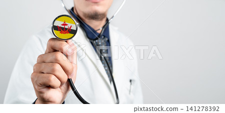 Brunei healthcare system, Bruneian national healthcare concept. Hand of doctor holding stethoscope Brunei healthcare system, Bruneian national healthcare concept. Hand of doctor holding stethoscope 141278392