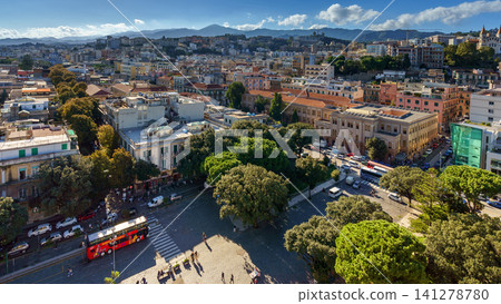 MESSINA, ITALY - NOVEMBER 06, 2018 - Panoramic top view of the local buildings with the trees, mountains and the sky in the beautiful city in Sicily MESSINA, ITALY - NOVEMBER 06, 2018 - Panoramic top view of the local buildings with the trees, mountains and the sky in the beautiful city in Sicily 141278780