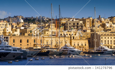 VALLETTA, MALTA - NOVEMBER 12, 2018 - The Grand Harbor Tricity bay, Birgu and Senglea islands with ships and boats in the port VALLETTA, MALTA - NOVEMBER 12, 2018 - The Grand Harbor Tricity bay, Birgu and Senglea islands with ships and boats in the port 141278796