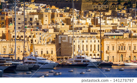 VALLETTA, MALTA - NOVEMBER 12, 2018 - The Grand Harbor Tricity bay, Birgu and Senglea islands with ships and boats in the port VALLETTA, MALTA - NOVEMBER 12, 2018 - The Grand Harbor Tricity bay, Birgu and Senglea islands with ships and boats in the port 141278797