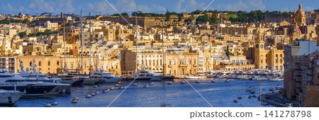 VALLETTA, MALTA - NOVEMBER 12, 2018 - The Grand Harbor Tricity bay, Birgu and Senglea islands with ships and boats in the port VALLETTA, MALTA - NOVEMBER 12, 2018 - The Grand Harbor Tricity bay, Birgu and Senglea islands with ships and boats in the port 141278798