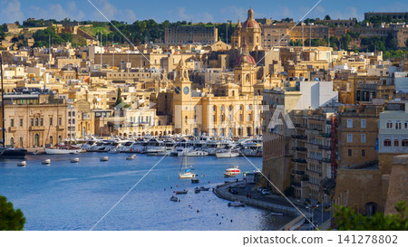 VALLETTA, MALTA - NOVEMBER 12, 2018 - The Grand Harbor Tricity bay, Birgu and Senglea islands with ships and boats in the port VALLETTA, MALTA - NOVEMBER 12, 2018 - The Grand Harbor Tricity bay, Birgu and Senglea islands with ships and boats in the port 141278802