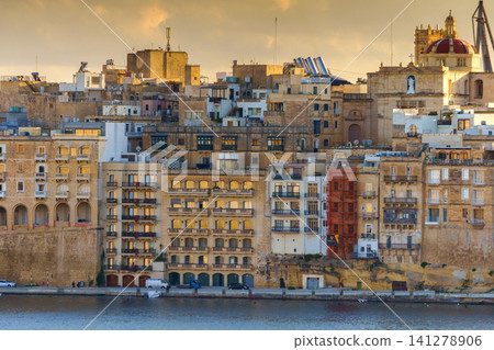 VALLETTA, MALTA - NOVEMBER 12, 2018 - Panoramic view of the Grand Harbor Tricity bay, Birgu and Senglea islands with ships and boats in the port VALLETTA, MALTA - NOVEMBER 12, 2018 - Panoramic view of the Grand Harbor Tricity bay, Birgu and Senglea islands with ships and boats in the port 141278906