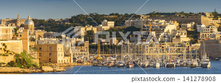 VALLETTA, MALTA - NOVEMBER 12, 2018 - Panoramic view of the Grand Harbor Tricity bay, Birgu and Senglea islands with ships and boats in the port VALLETTA, MALTA - NOVEMBER 12, 2018 - Panoramic view of the Grand Harbor Tricity bay, Birgu and Senglea islands with ships and boats in the port 141278908