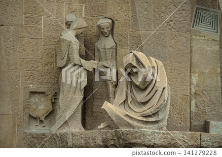 BARCELONA, SPAIN - NOVEMBER 09, 2018 - Exterior elements details of La Sagrada Familia church with scenes from Holy Bible BARCELONA, SPAIN - NOVEMBER 09, 2018 - Exterior elements details of La Sagrada Familia church with scenes from Holy Bible 141279228