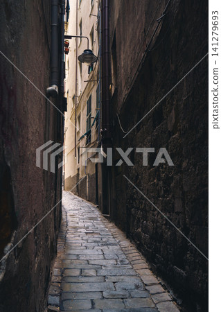 GENOA, ITALY - NOVEMBER 04, 2018 - Narrow streets of the old city GENOA, ITALY - NOVEMBER 04, 2018 - Narrow streets of the old city 141279693