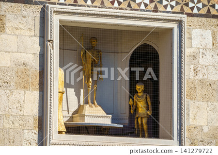 MESSINA, ITALY - NOVEMBER 06, 2018 - Decorations and golden elements of the Bell Tower of the Cathedral of Messina, Sicily MESSINA, ITALY - NOVEMBER 06, 2018 - Decorations and golden elements of the Bell Tower of the Cathedral of Messina, Sicily 141279722