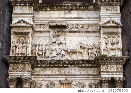 NAPLES, ITALY - NOVEMBER 05, 2018 - The medieval castle of Maschio Angioino or Castel Nuovo or New Castle and its elements of decoration, Napoli NAPLES, ITALY - NOVEMBER 05, 2018 - The medieval castle of Maschio Angioino or Castel Nuovo or New Castle and its elements of decoration, Napoli 141279893