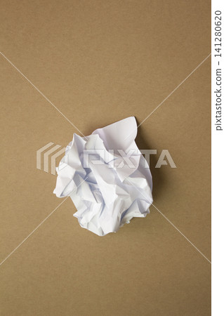 Crumpled paper isolated on brown background . Crumpled paper isolated on brown background . 141280620