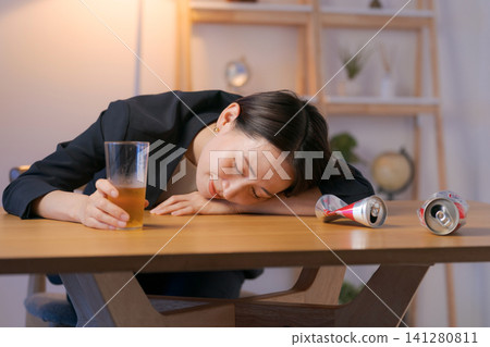 A woman in a suit who is passed out drunk. A woman in a suit who is passed out drunk. 141280811