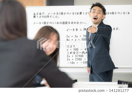 A female high school student is reprimanded by a teacher for talking during class; school education and classroom guidance scenes; images of internal evaluation and student guidance. A female high school student is reprimanded by a teacher for talking during class; school education and classroom guidance scenes; images of internal evaluation and student guidance. 141281277