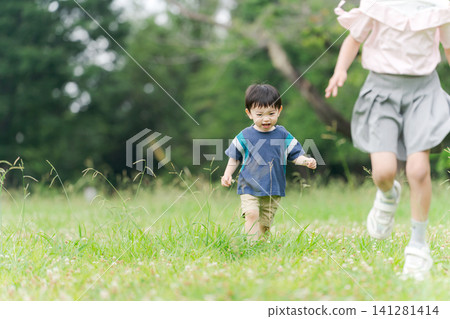 Children walking hand in hand 141281414