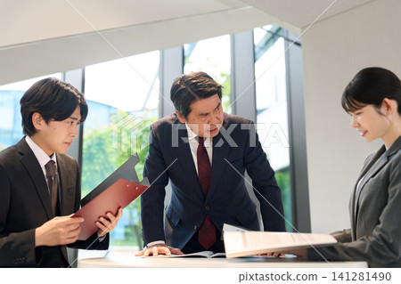 A boss who blames his subordinates in a meeting A boss who blames his subordinates in a meeting 141281490