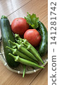 Summer vegetables served in a colander Summer vegetables served in a colander 141281742