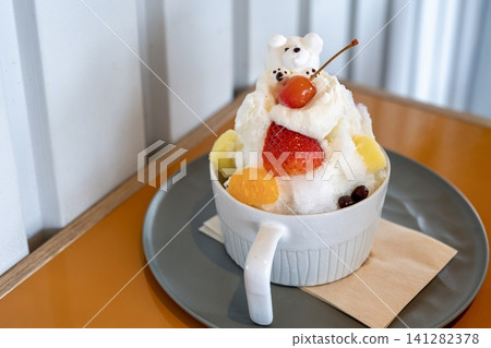 Fruit-filled bear-shaped shaved ice dessert Fruit-filled bear-shaped shaved ice dessert 141282378
