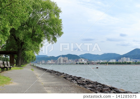 The promenade along Lake Biwa and the cityscape on the opposite shore The promenade along Lake Biwa and the cityscape on the opposite shore 141285075
