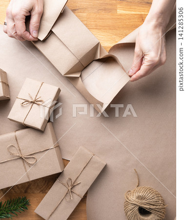 Christmas Present Wrapping Process Female Hands Christmas Present Wrapping Process Female Hands 141285306